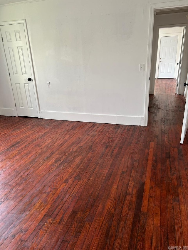 601 N Hickory, Searcy, AR 72143 - spare room with baseboards and dark wood finished floors