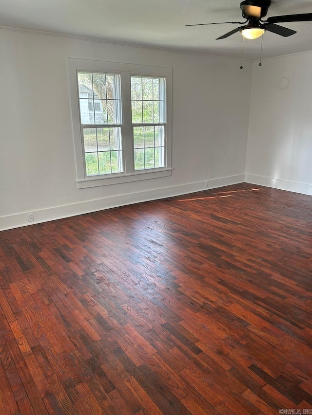 601 N Hickory, Searcy, AR 72143 - unfurnished room with dark wood finished floors, ceiling fan, and baseboards
