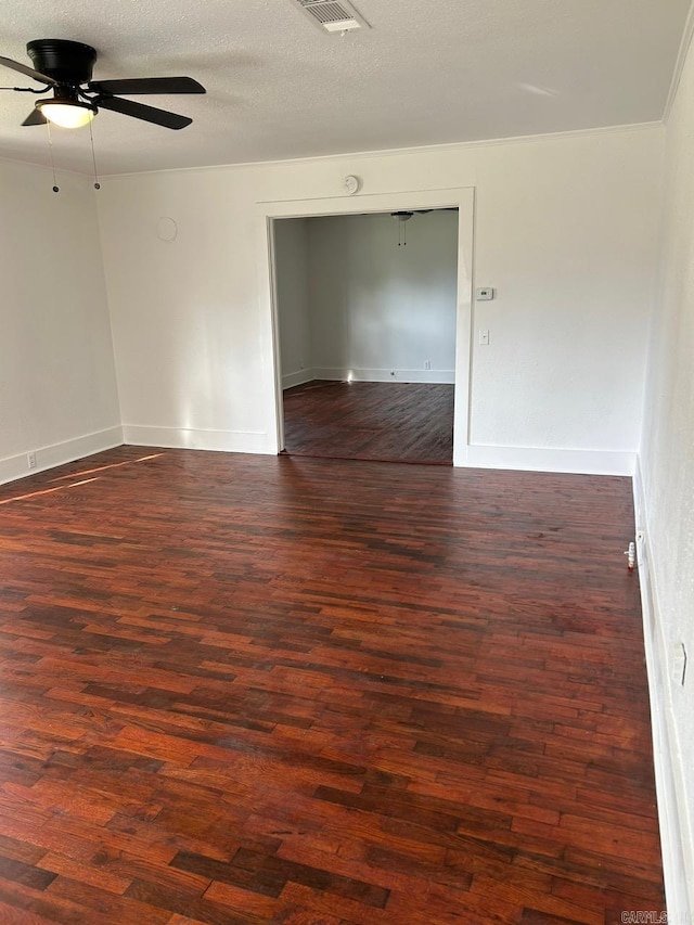 601 N Hickory, Searcy, AR 72143 - unfurnished room with ceiling fan, dark wood finished floors, and baseboards