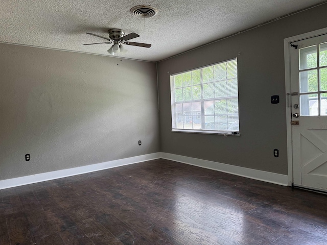 802 Desoto Pl, Benton, AR 72015 - spare room featuring ceiling fan, dark wood-style flooring, baseboards, and a textured ceiling