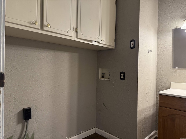 802 Desoto Pl, Benton, AR 72015 - laundry room with washer hookup, cabinet space, and a textured wall