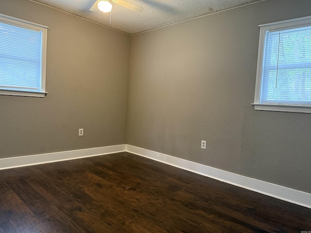 802 Desoto Pl, Benton, AR 72015 - unfurnished room with dark wood-style floors, baseboards, a ceiling fan, and a textured ceiling