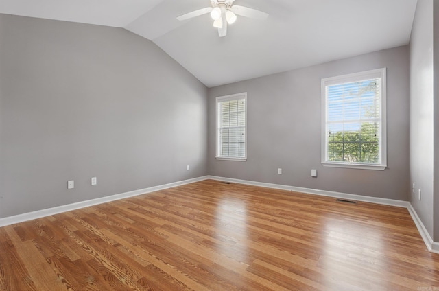 19 Golden Oaks Cv, Maumelle, AR 72113 - empty room with a ceiling fan, vaulted ceiling, light wood-style floors, and baseboards