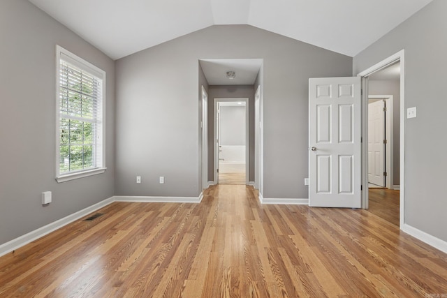 19 Golden Oaks Cv, Maumelle, AR 72113 - unfurnished bedroom with light wood-style flooring, baseboards, and vaulted ceiling