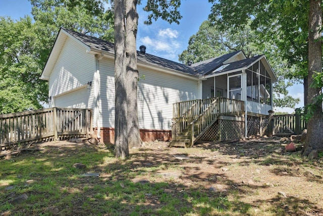 19 Golden Oaks Cv, Maumelle, AR 72113 - back of property with a sunroom, a garage, fence, and stairway