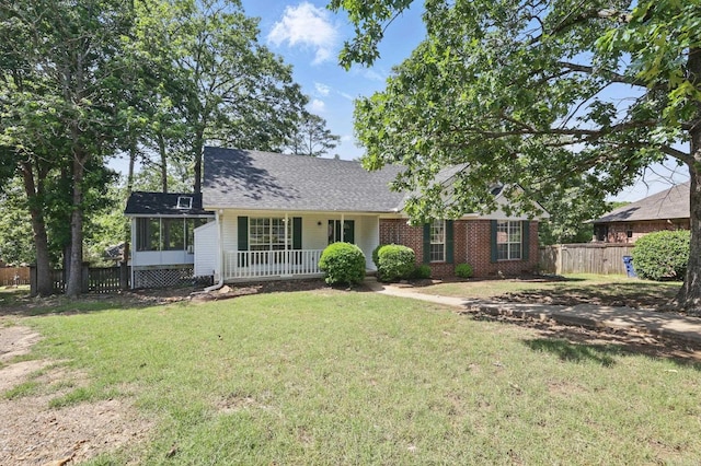 19 Golden Oaks Cv, Maumelle, AR 72113 - view of front of house featuring a sunroom, brick siding, and roof with shingles