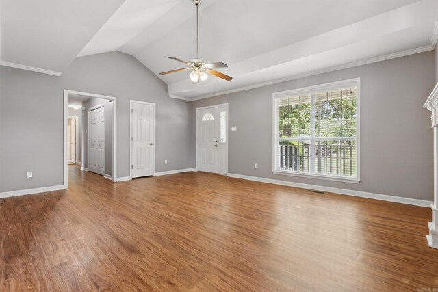 19 Golden Oaks Cv, Maumelle, AR 72113 - unfurnished living room featuring ceiling fan, ornamental molding, baseboards, wood finished floors, and vaulted ceiling
