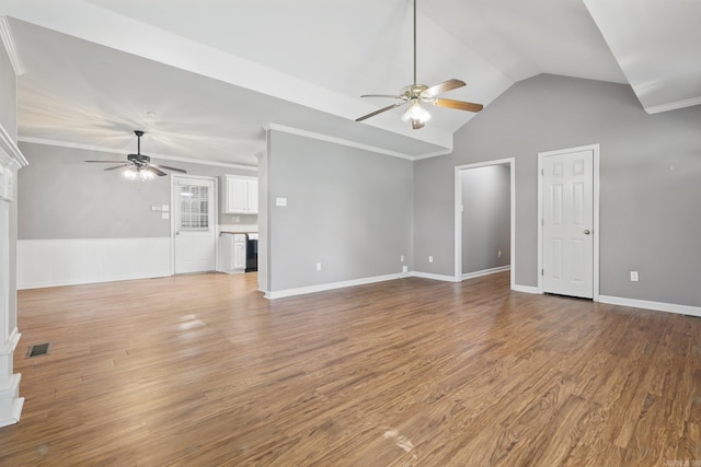 19 Golden Oaks Cv, Maumelle, AR 72113 - unfurnished living room featuring ceiling fan, a wainscoted wall, light wood-style flooring, lofted ceiling, and ornamental molding