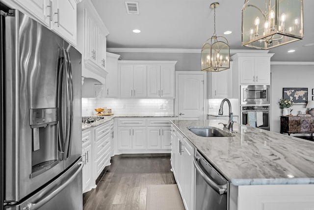 9224 Meadow Gardens Cir, Sherwood, AR 72120 - kitchen with stainless steel appliances, a sink, a chandelier, crown molding, and recessed lighting