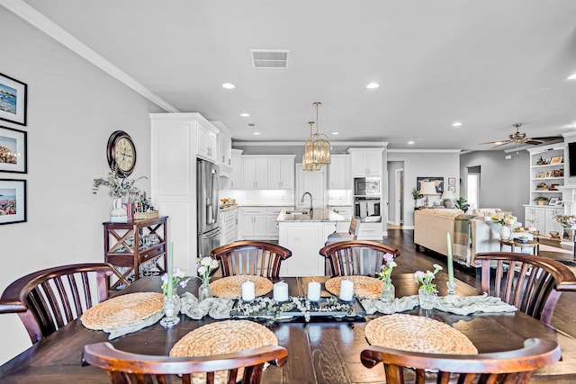 9224 Meadow Gardens Cir, Sherwood, AR 72120 - dining space with recessed lighting, ceiling fan, dark wood-style floors, and crown molding