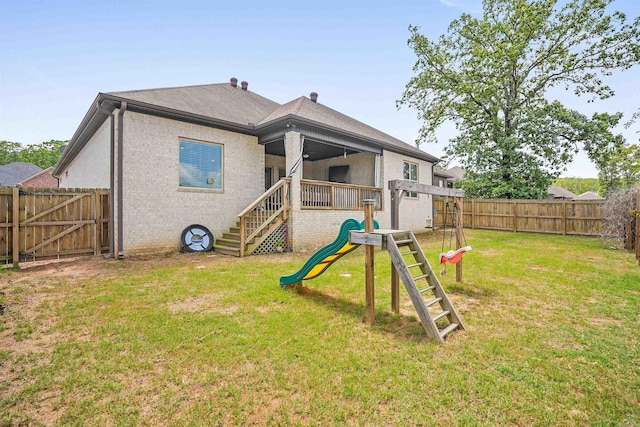 9224 Meadow Gardens Cir, Sherwood, AR 72120 - rear view of house with a playground, brick siding, and roof with shingles