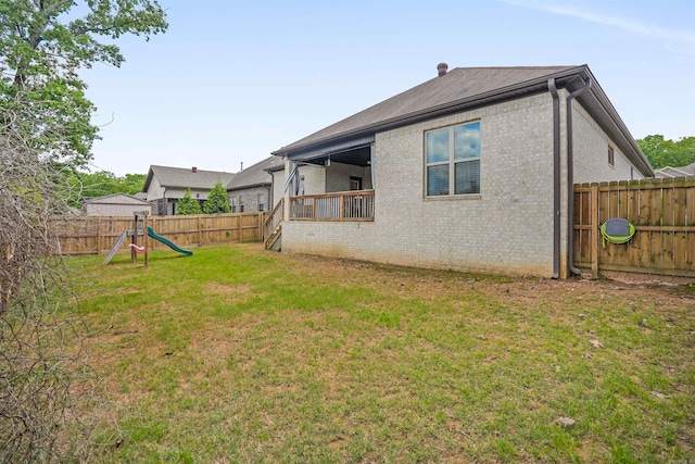 9224 Meadow Gardens Cir, Sherwood, AR 72120 - back of property featuring brick siding and a playground