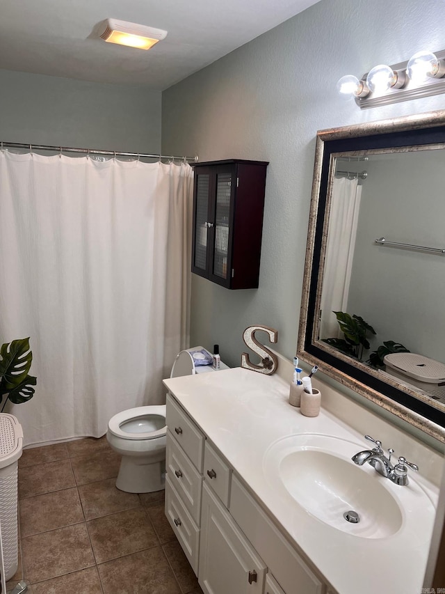 full bathroom with vanity, tile patterned floors, and toilet