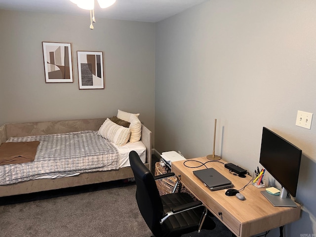 bedroom featuring carpet and an office area