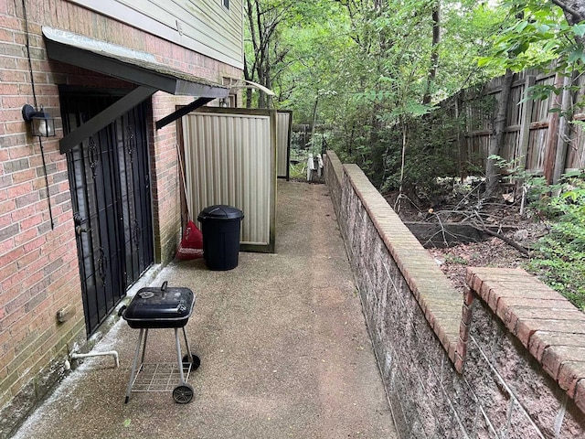 view of patio featuring fence