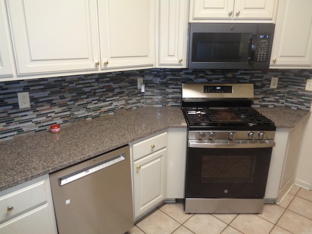 6 Jack Nicklaus Cv, Little Rock, AR 72210 - kitchen featuring stainless steel appliances, light tile patterned flooring, white cabinets, and tasteful backsplash