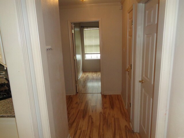 6 Jack Nicklaus Cv, Little Rock, AR 72210 - corridor with light wood-style flooring, crown molding, and baseboards