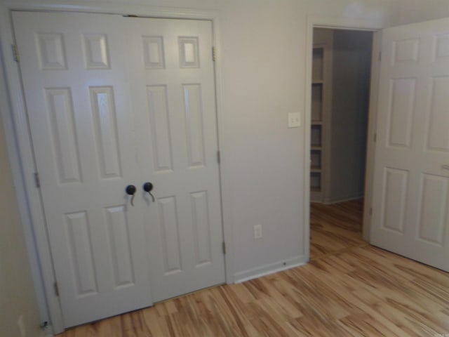 6 Jack Nicklaus Cv, Little Rock, AR 72210 - unfurnished bedroom featuring light wood-type flooring and baseboards