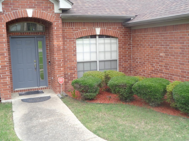 6 Jack Nicklaus Cv, Little Rock, AR 72210 - property entrance with roof with shingles and brick siding