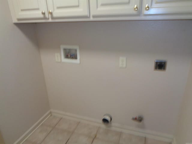 6 Jack Nicklaus Cv, Little Rock, AR 72210 - laundry area featuring cabinet space, electric dryer hookup, hookup for a washing machine, light tile patterned flooring, and baseboards