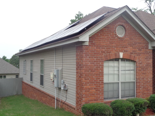 6 Jack Nicklaus Cv, Little Rock, AR 72210 - view of side of home featuring brick siding, fence, and solar panels