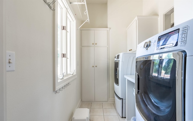 12 Sacedon Trce, Hot Springs Village, AR 71909 - laundry room with separate washer and dryer, cabinet space, plenty of natural light, and light tile patterned floors