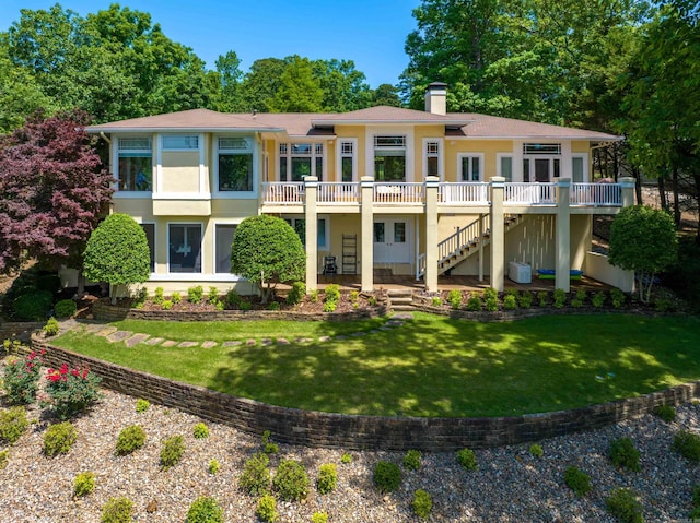 12 Sacedon Trce, Hot Springs Village, AR 71909 - back of house featuring stucco siding, stairs, a chimney, and a wooden deck