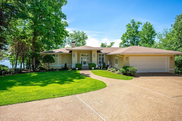 12 Sacedon Trce, Hot Springs Village, AR 71909 - ranch-style home with an attached garage, stucco siding, concrete driveway, a front yard, and a chimney