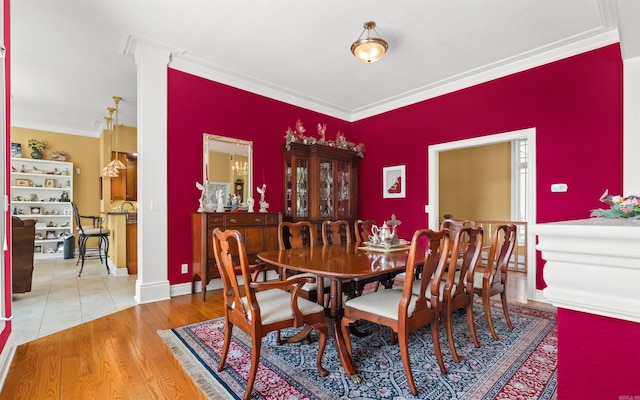 12 Sacedon Trce, Hot Springs Village, AR 71909 - dining room featuring ornamental molding, ornate columns, and wood finished floors