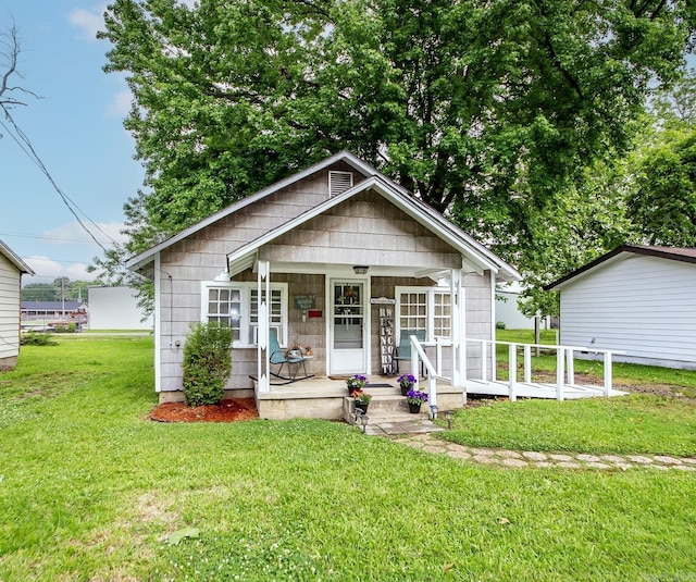 206 S Grant St, Cabot, AR 72023 - bungalow featuring covered porch and a front lawn