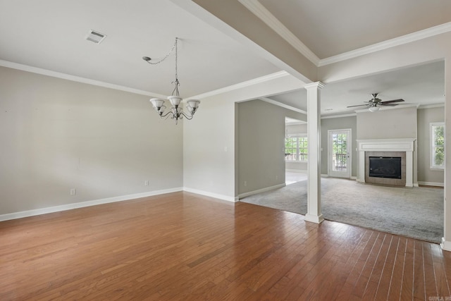 113 Shady Dr, Maumelle, AR 72113 - unfurnished living room featuring hardwood / wood-style floors, baseboards, a tiled fireplace, a chandelier, and crown molding