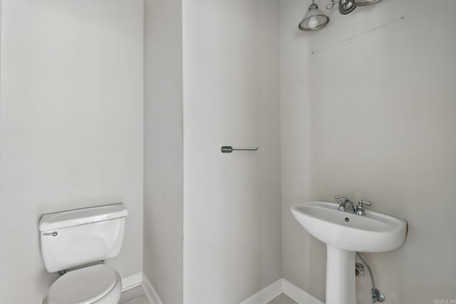 113 Shady Dr, Maumelle, AR 72113 - half bath with toilet, baseboards, and a sink