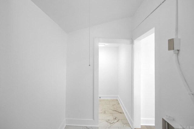 2501 S Maple St, Little Rock, AR 72204 - hallway featuring light marble finish flooring, baseboards, and lofted ceiling