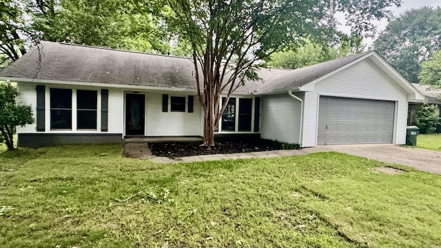 single story home featuring a garage, driveway, and a front yard
