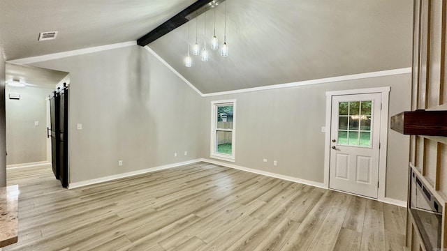 unfurnished living room with a barn door, light wood-type flooring, and baseboards