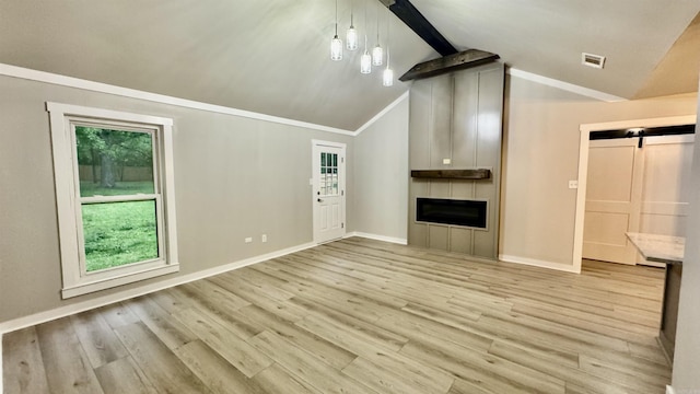 unfurnished living room featuring a barn door, light wood-style floors, baseboards, a large fireplace, and ornamental molding