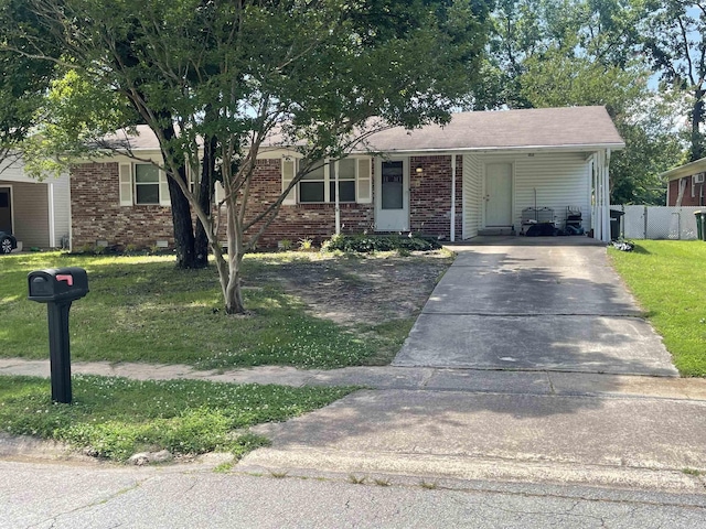 view of front of property featuring driveway, brick siding, and an attached carport