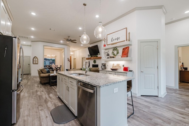 92 Hudson Dr, Sheridan, AR 72150 - kitchen featuring appliances with stainless steel finishes, light wood-style floors, ceiling fan, recessed lighting, and a center island with sink