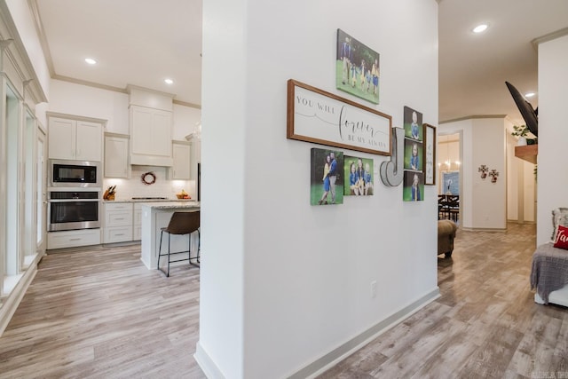 92 Hudson Dr, Sheridan, AR 72150 - hallway with light wood-style floors, recessed lighting, baseboards, and crown molding