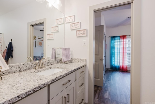 92 Hudson Dr, Sheridan, AR 72150 - ensuite bathroom with wood finished floors and vanity