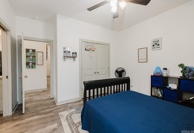 92 Hudson Dr, Sheridan, AR 72150 - bedroom featuring light wood-style flooring, a closet, a ceiling fan, and baseboards