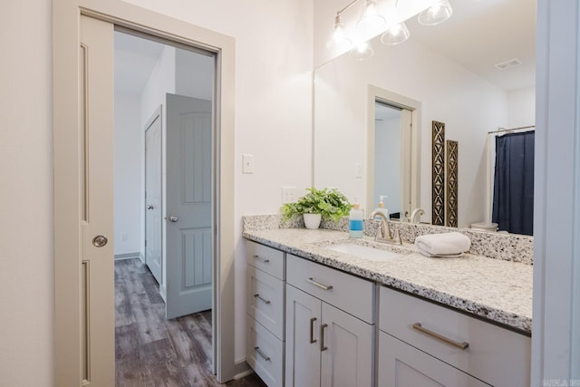 92 Hudson Dr, Sheridan, AR 72150 - bathroom featuring vanity and wood finished floors
