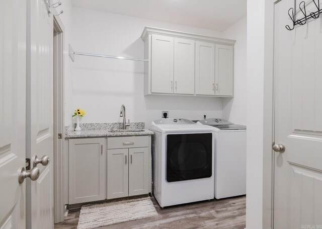 92 Hudson Dr, Sheridan, AR 72150 - laundry area with cabinet space, separate washer and dryer, and light wood-type flooring
