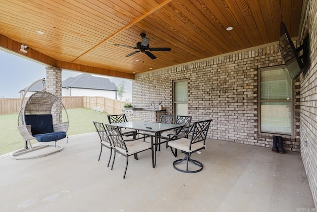92 Hudson Dr, Sheridan, AR 72150 - fenced backyard with outdoor dining area, a patio area, and a ceiling fan