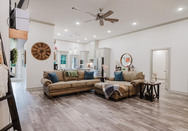 92 Hudson Dr, Sheridan, AR 72150 - living area featuring ceiling fan, light wood-type flooring, recessed lighting, baseboards, and ornamental molding