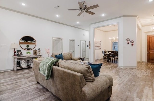92 Hudson Dr, Sheridan, AR 72150 - living area with crown molding, a chandelier, light wood finished floors, a ceiling fan, and recessed lighting