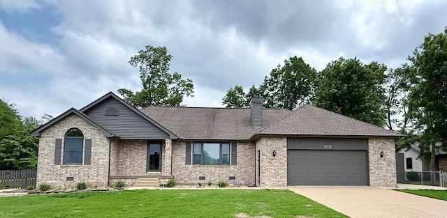 view of front of house featuring brick siding, an attached garage, driveway, and a chimney