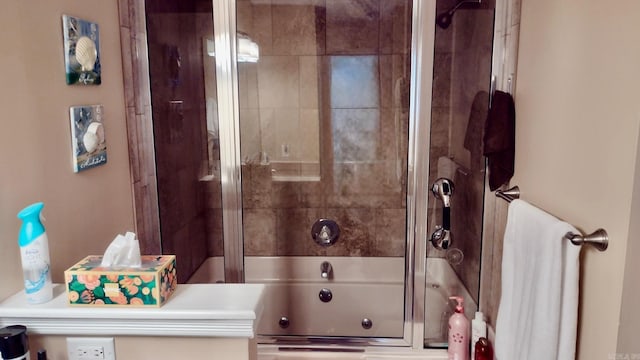 full bathroom featuring combined bath / shower with glass door