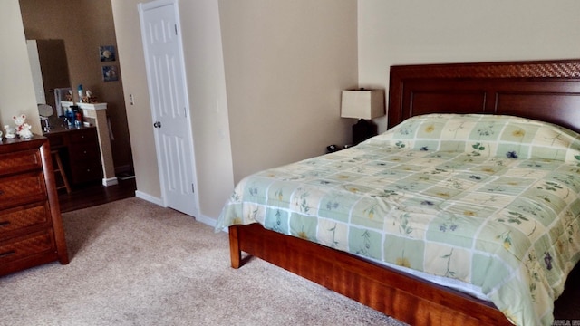 carpeted bedroom with baseboards