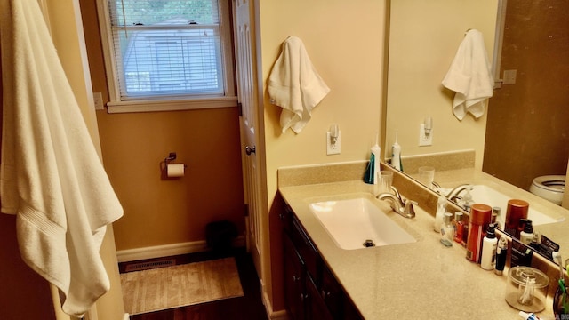 bathroom with vanity and toilet